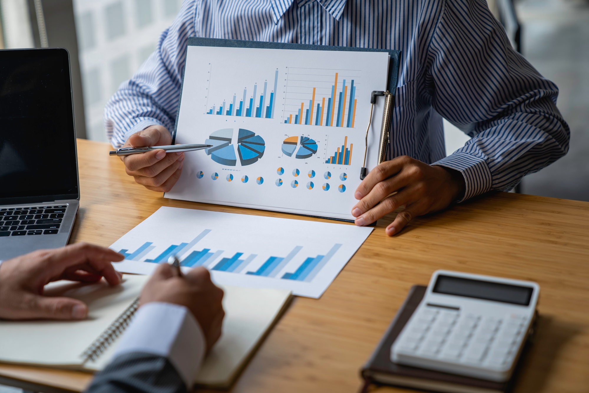 Business advisor analyzing financial figures denoting the progress Internal Revenue Service checking
